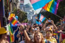 parade with rainbow and trans flags